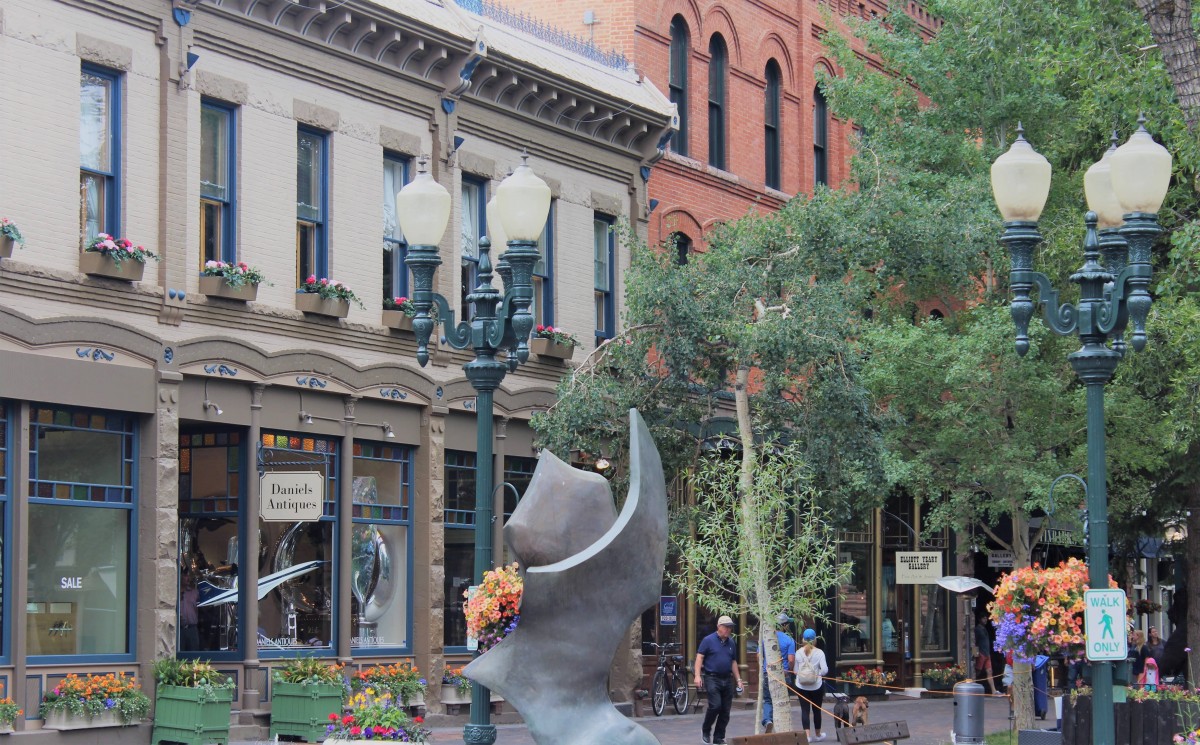Shops in downtown Aspen (Daniel's Antiques). You can see old lamposts and lots of flower boxes.