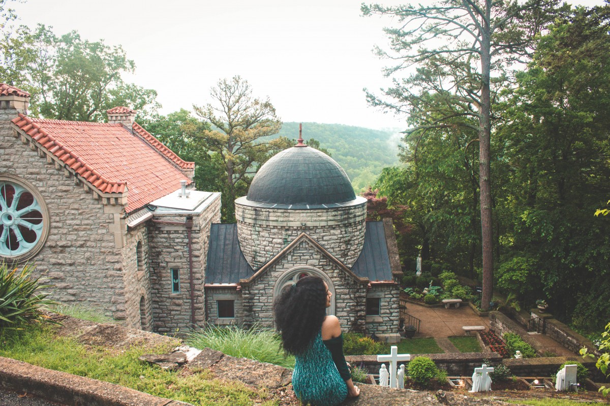 Sitting on the ledge of St Elizabeth Catholic Church looking over the Ozarks in Eureka Springs