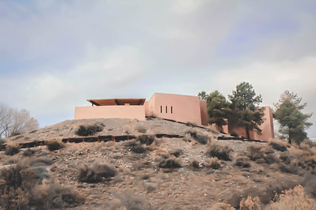 salmon colored building (the museum) on a mound