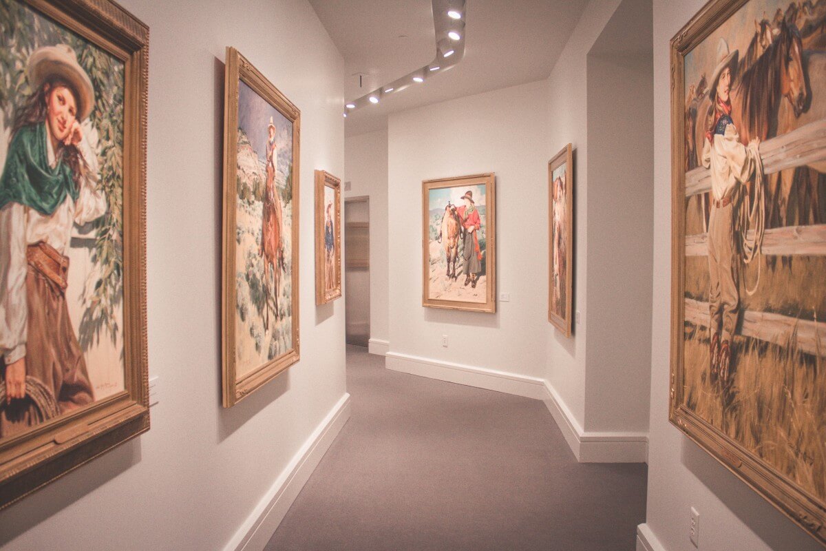 hall of Western cowgirl paintings by Terri Kelly Moyers' 