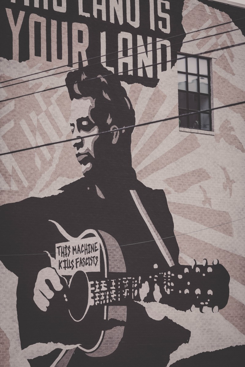 street art on the side of the Woodie Guthrie Center, one of the top things to do in Tulsa