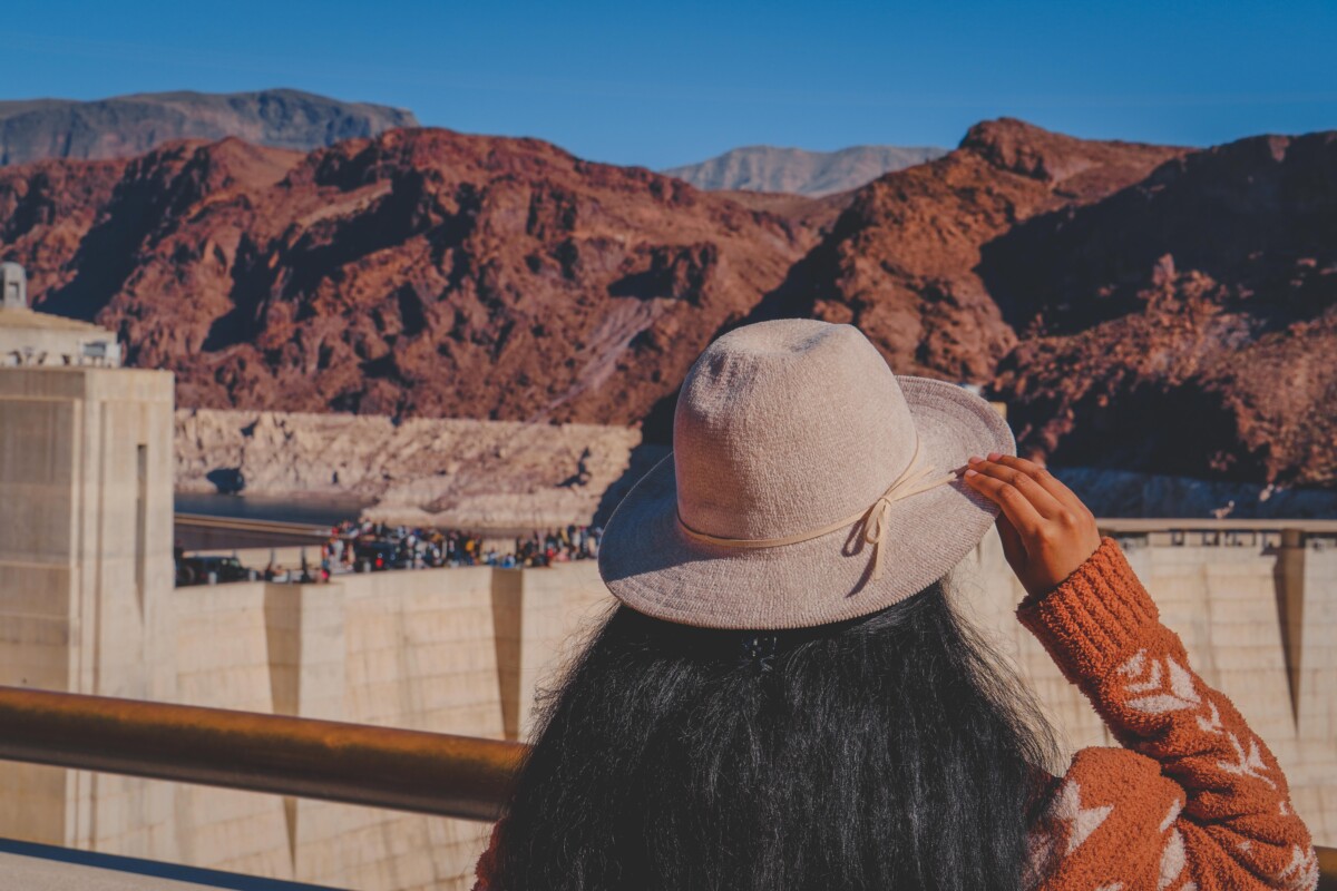 hoover dam takes a half-day to see (person filling up half the frame of hoover dam picture)