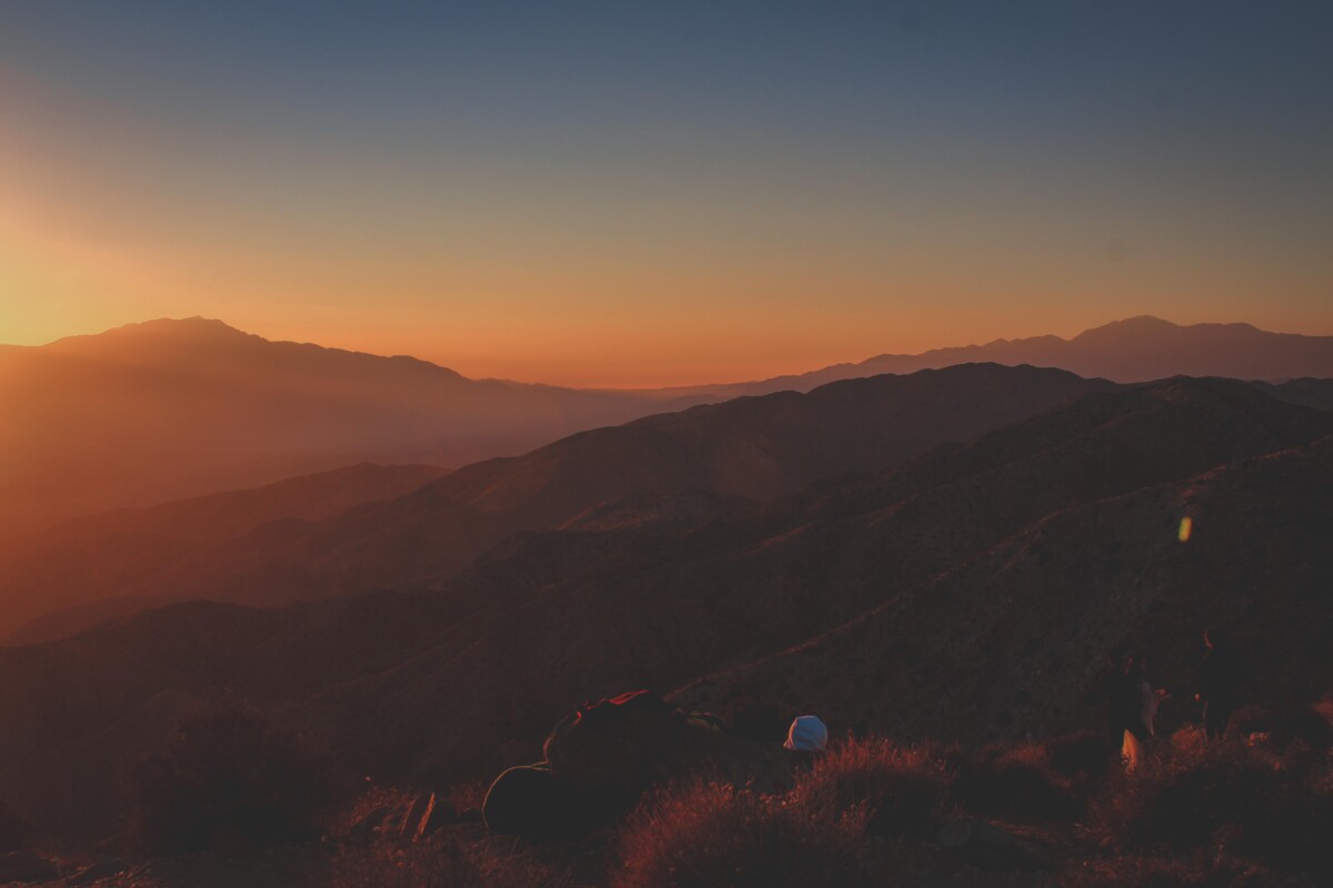 person backpacking and picnicking at Keys View at sunset