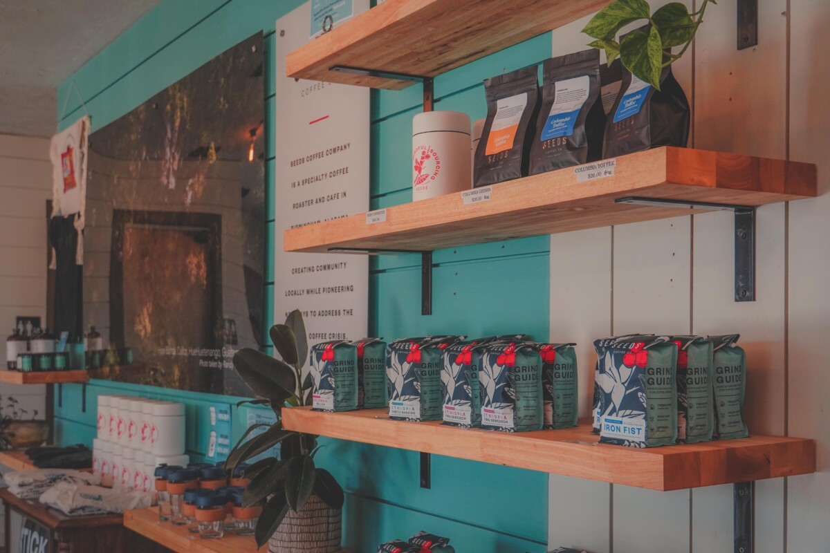 Seeds Coffee: wall of coffee bags available for purchase to take home