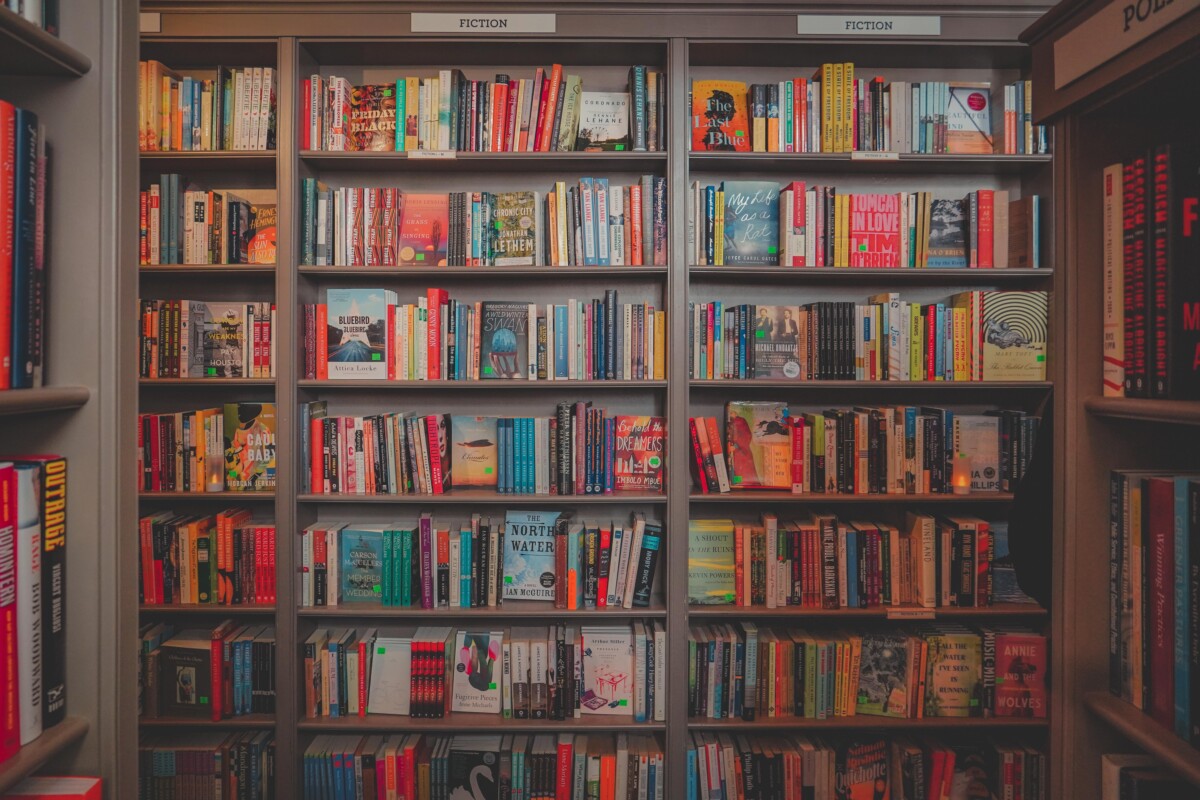 Portsmouth Book & Bar wall of fiction books, one of the best bookstores in Porsmouth
