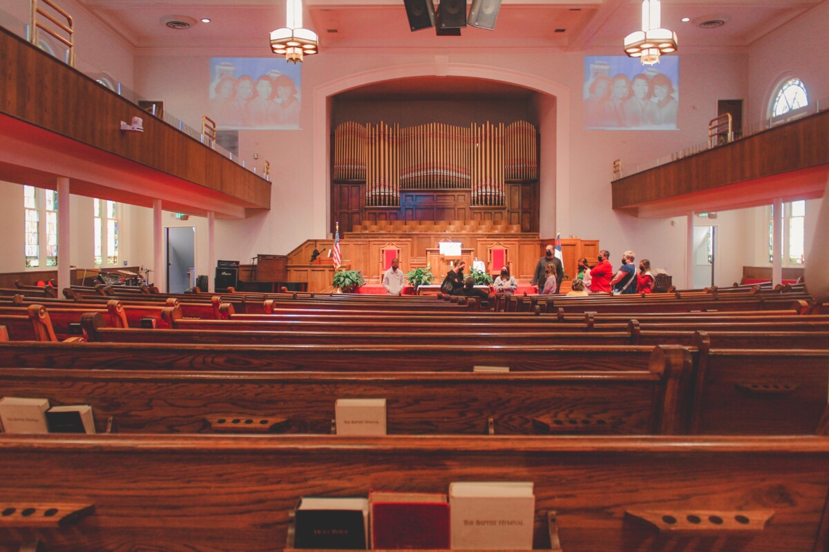 inside 16th Street Baptist Church, group tour and pews and organ photo