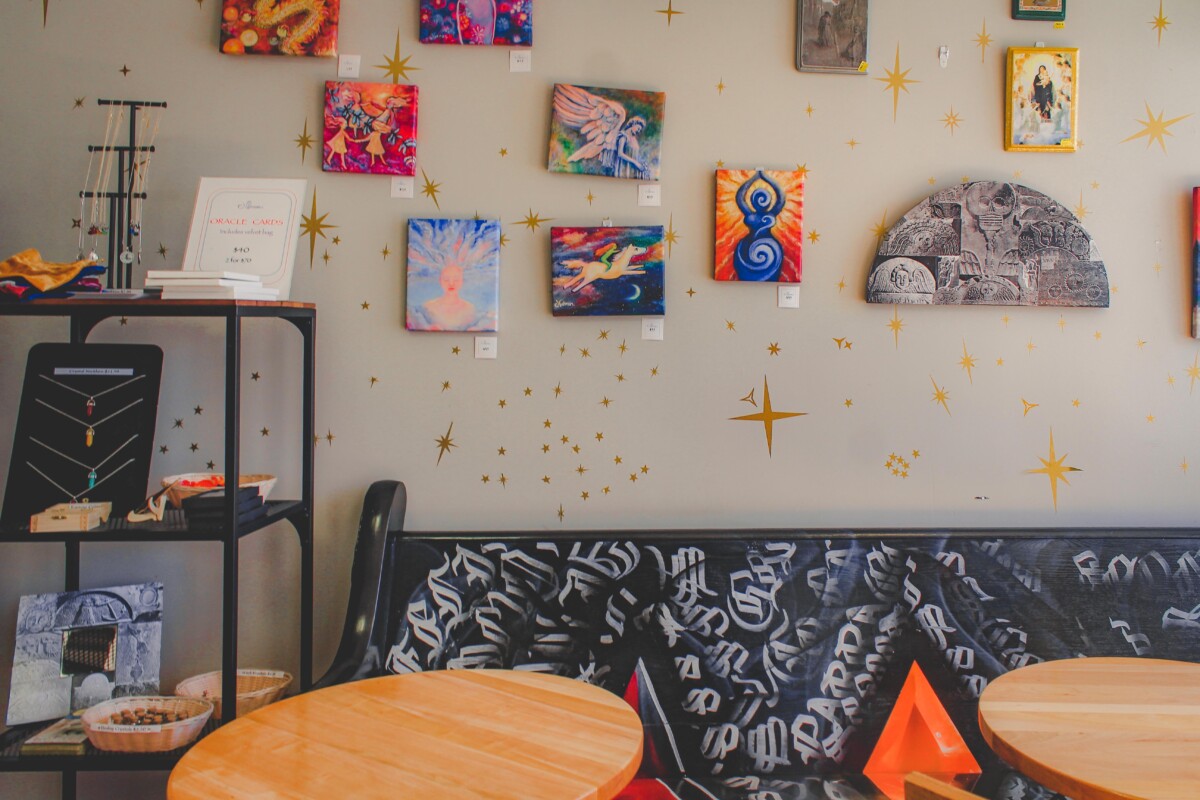 wall of art at Spells Coffee, one of the best coffee shops in Salem